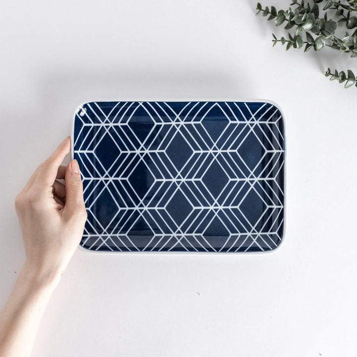 Modern Indigo Tile dinner plate with geometric white diamond pattern on deep navy blue background.