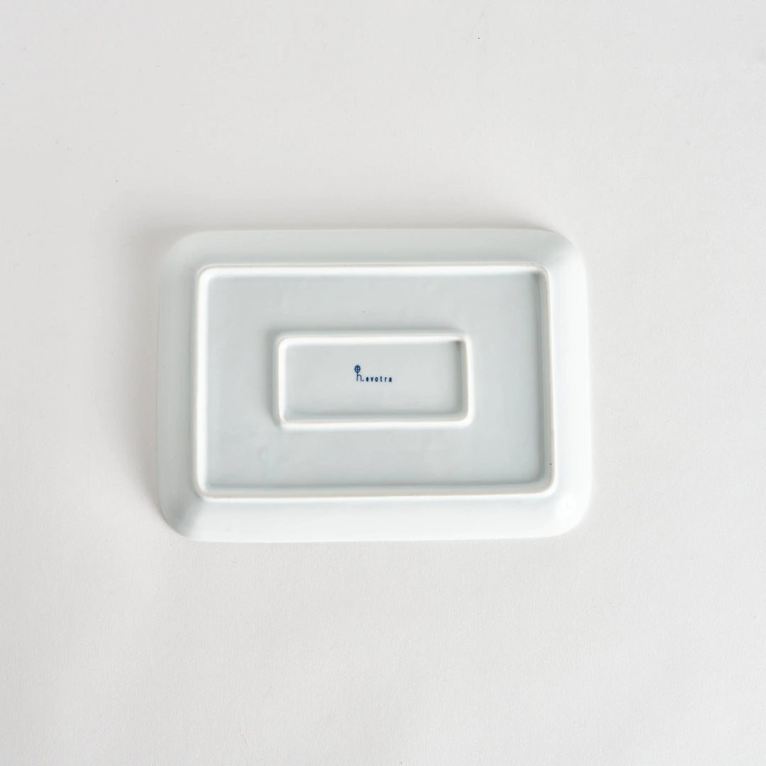 Back view of the Modern Indigo Tile Dinner Plate, showing a smooth white surface with the kiln’s name elegantly stamped.