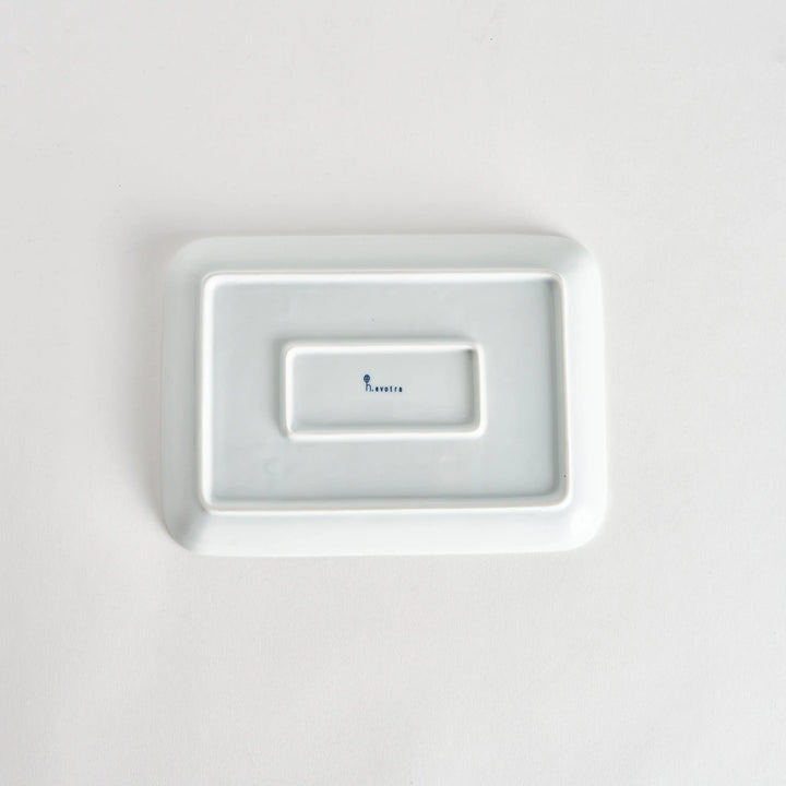 Back view of the Modern Indigo Tile Dinner Plate, showing a smooth white surface with the kiln’s name elegantly stamped.