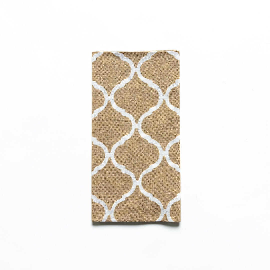 Close-up of the beige Moroccan tile hand towel folded with product sleeve attached.