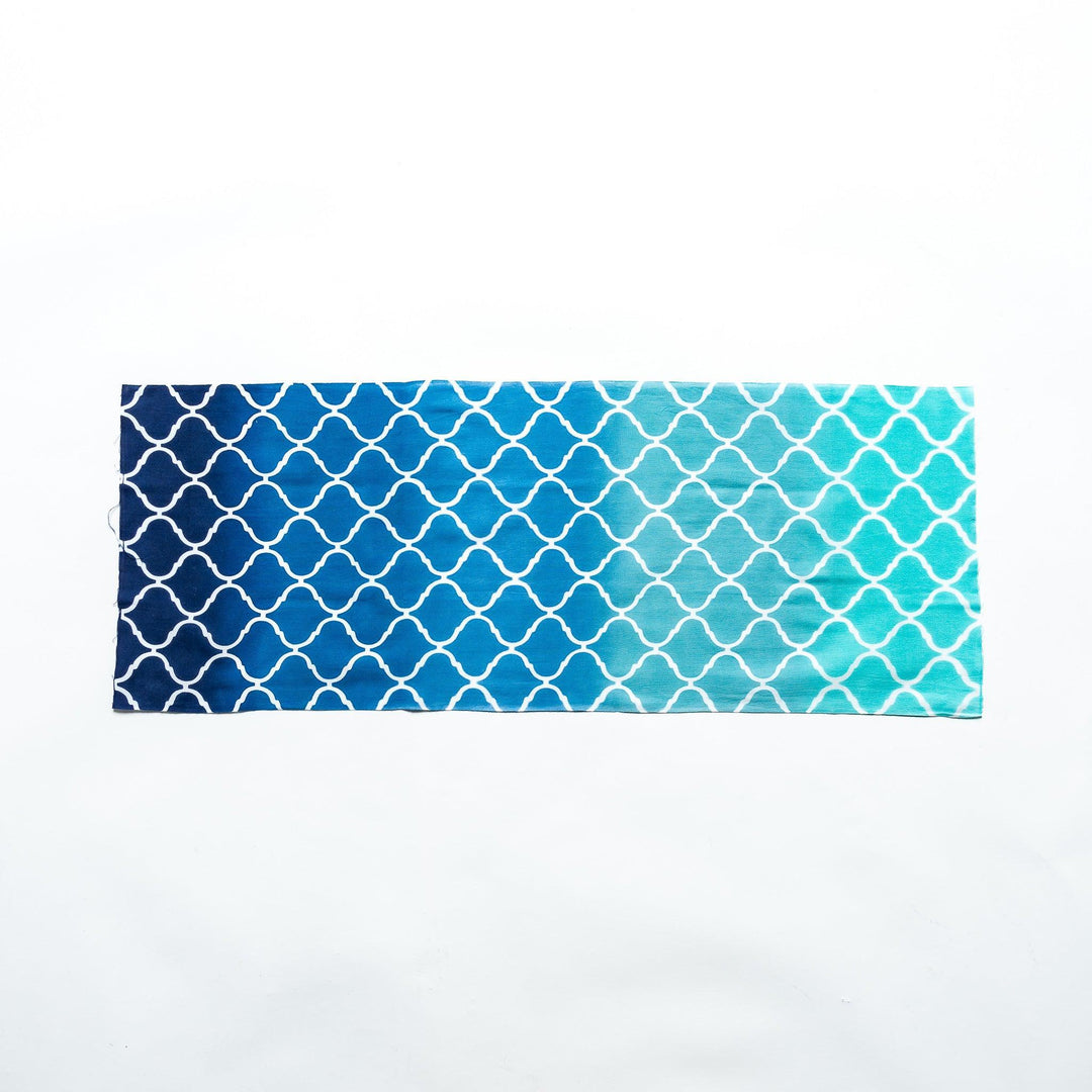 Moroccan tile-patterned blue tenugui hand towel laid flat, showcasing its full design.