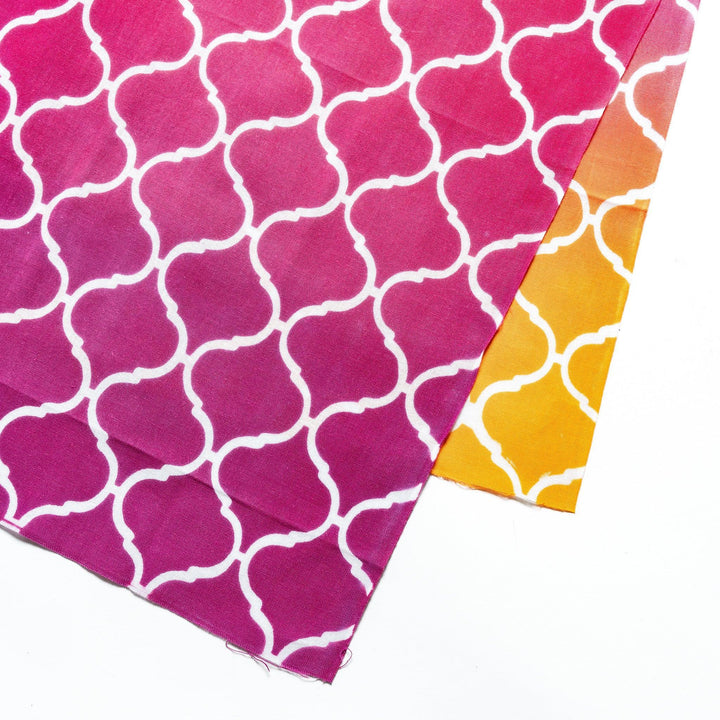 Close-up view of the white lattice pattern on the vibrant pink tenugui hand towel.
