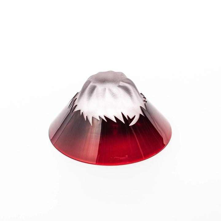 Red glass sake cup shaped like Mount Fuji with a frosted snowcap, ideal for elegant Japanese-style celebrations.