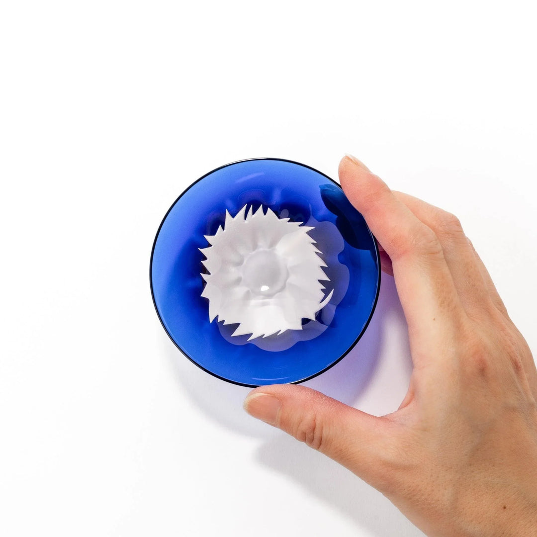 Blue glass sake cup shaped like Mount Fuji with a frosted snowcap, perfect for celebrations and Japanese dining.