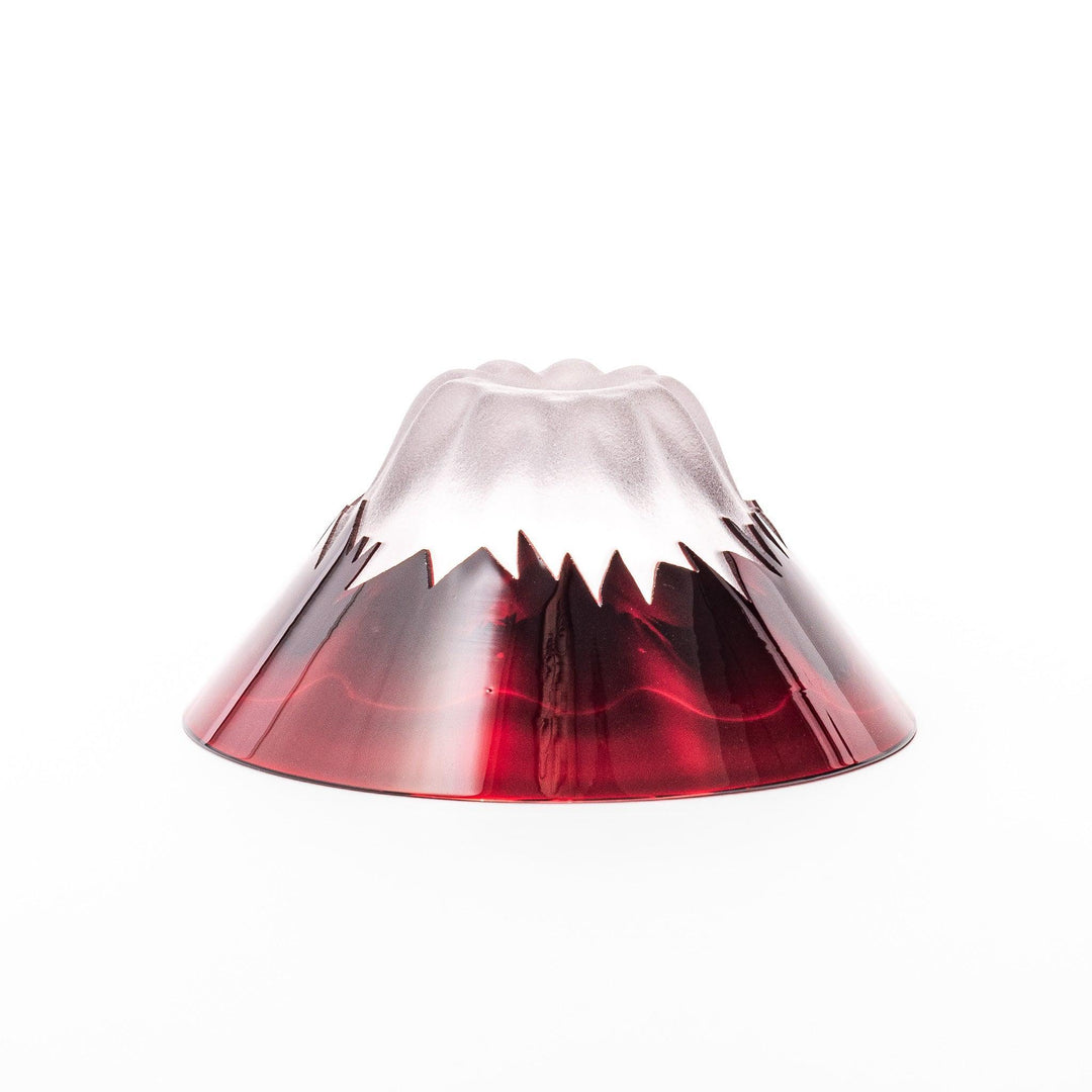 Red glass sake cup shaped like Mount Fuji with a frosted snowcap, ideal for elegant Japanese-style celebrations.
