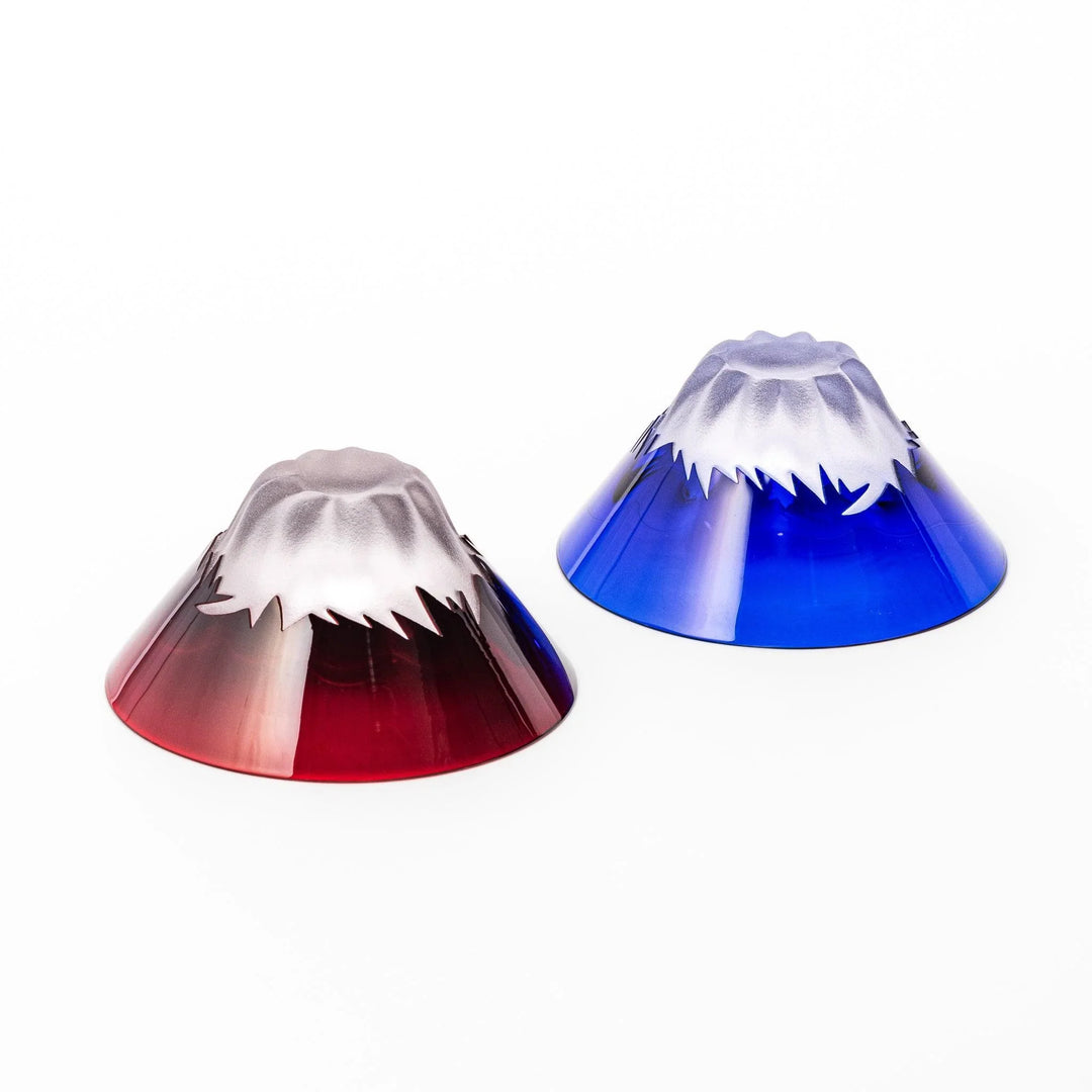 Mount Fuji sake cups in red and blue glass with frosted snowcaps, perfect for festive toasts or gifting.