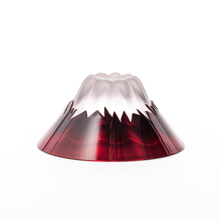 Red glass sake cup shaped like Mount Fuji with a frosted snowcap, perfect for elegant Japanese celebrations.