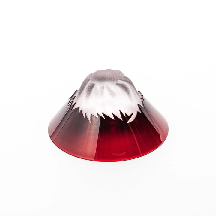 Red glass sake cup shaped like Mount Fuji with a frosted snowcap, perfect for elegant Japanese celebrations.