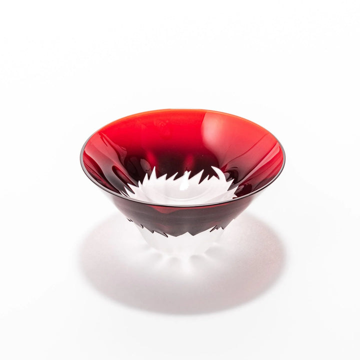 Red glass sake cup shaped like Mount Fuji with a frosted snowcap, perfect for elegant Japanese celebrations.