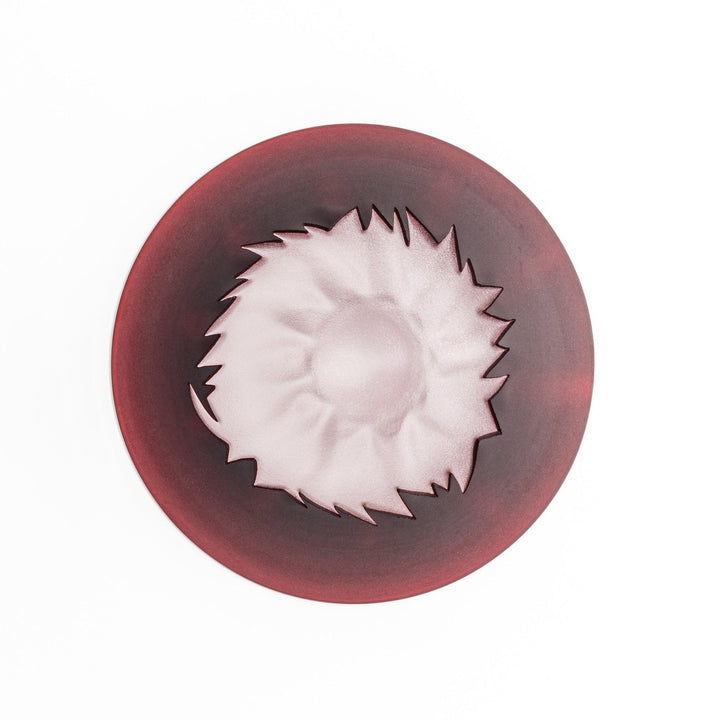 Red glass sake cup shaped like Mount Fuji with a frosted snowcap, perfect for elegant Japanese celebrations.