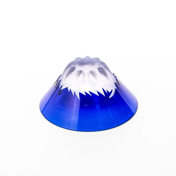 Blue glass sake cup shaped like Mount Fuji with frosted snowcap, ideal for festive and authentic Japanese dining.