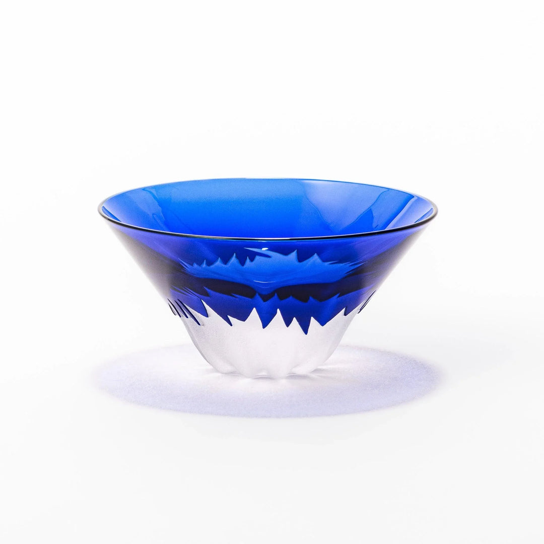Blue glass sake cup shaped like Mount Fuji with frosted snowcap, ideal for festive and authentic Japanese dining.