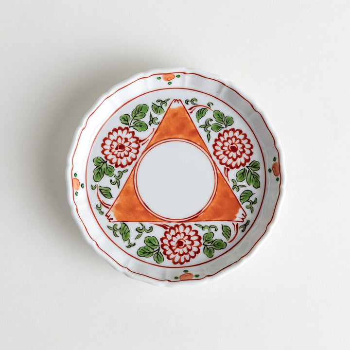 A dessert plate featuring a vibrant chrysanthemum and foliage design with an orange triangular motif encircling the center.