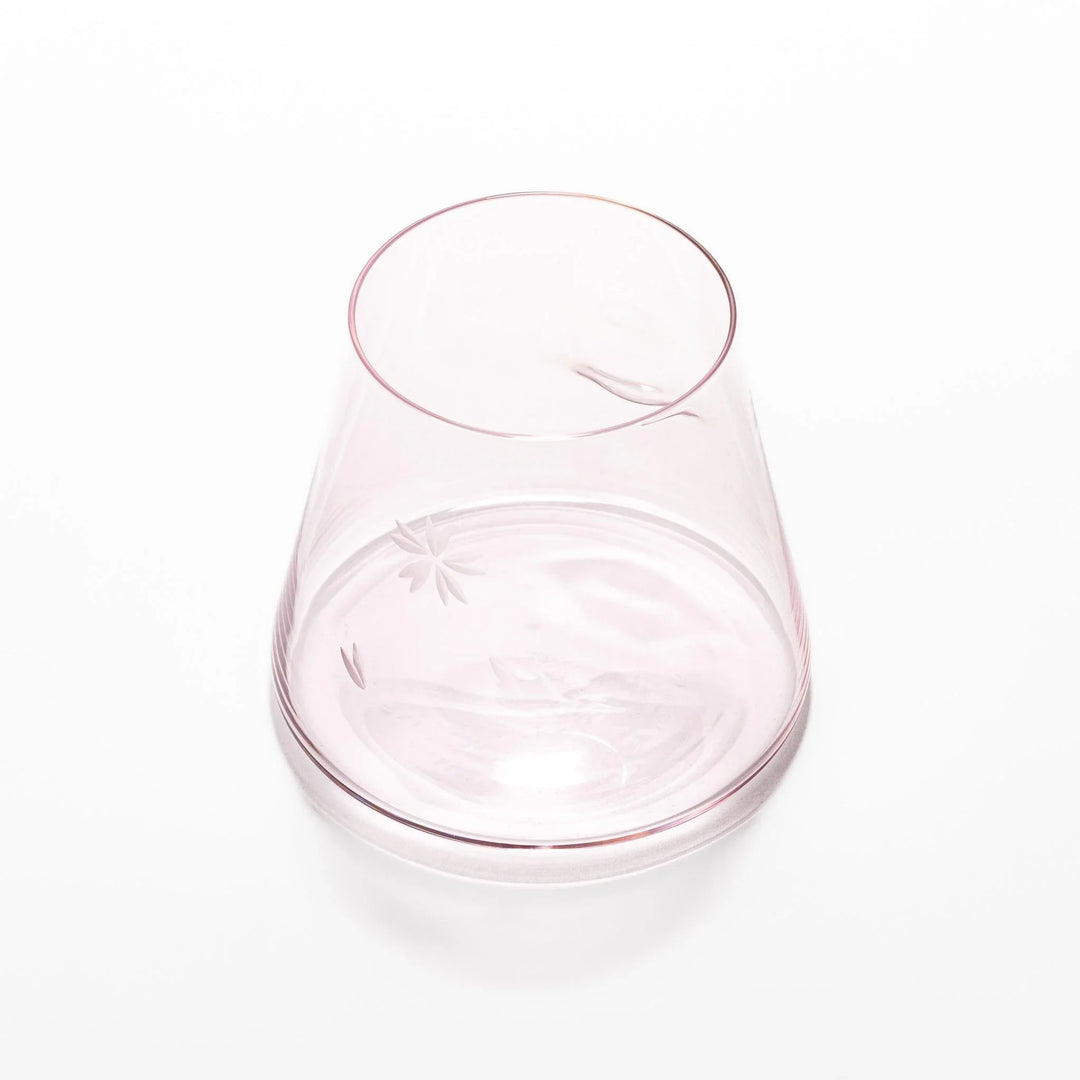 Light pink Mount Fuji beer glass with etched cherry blossoms, perfect for spring drinks and elegant settings.