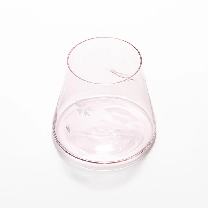 Light pink Mount Fuji beer glass with etched cherry blossoms, perfect for spring drinks and elegant settings.