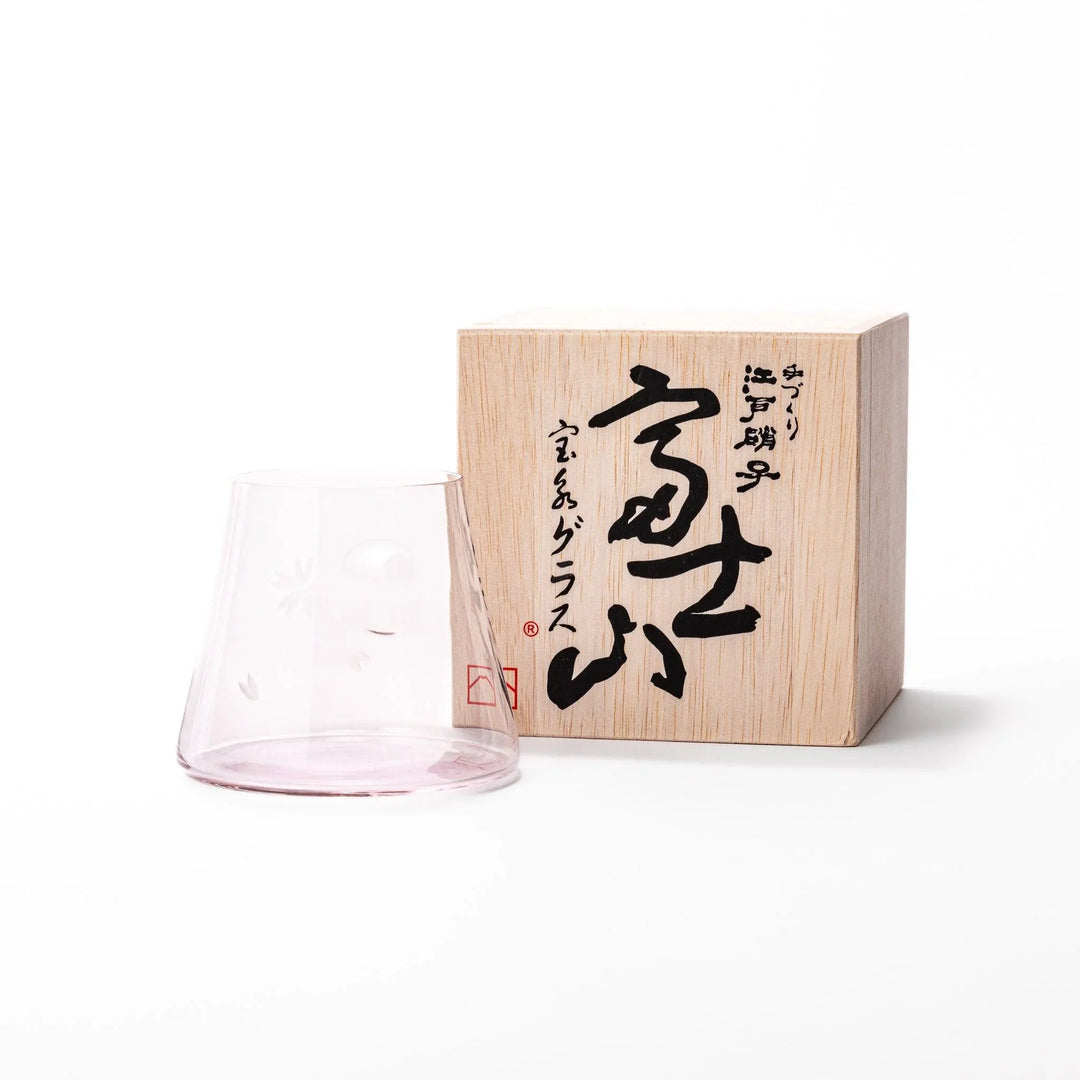 Light pink Mount Fuji beer glass with etched cherry blossoms, perfect for spring drinks and elegant settings.