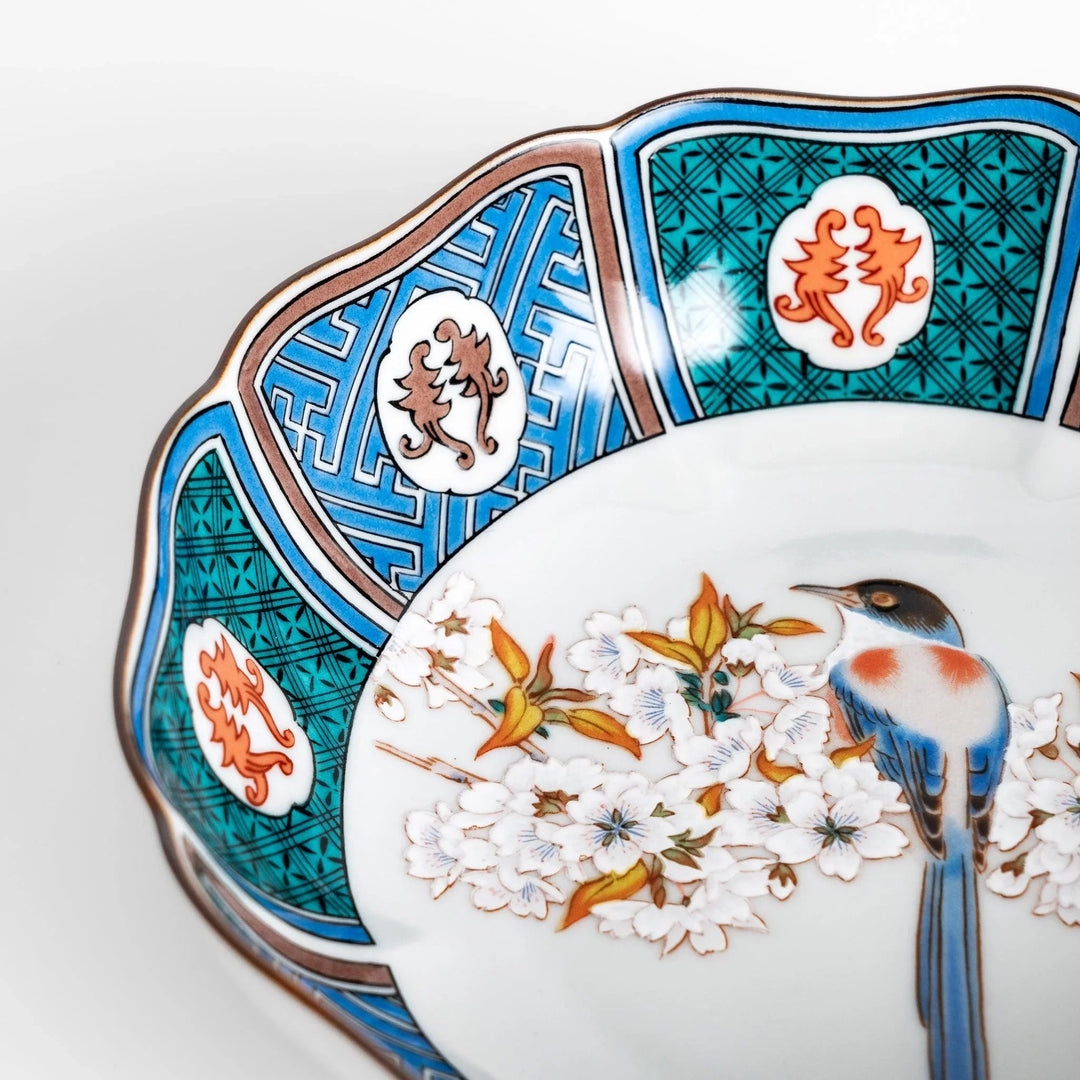 Cereal Bowl featuring a vibrant bird perched on blossoming sakura flowers, framed by intricate blue patterns.