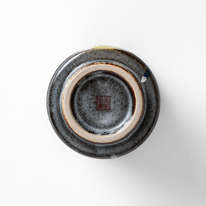 Tea Cup featuring a bird perched on blooming sakura flowers, set against a yellow and gray background.