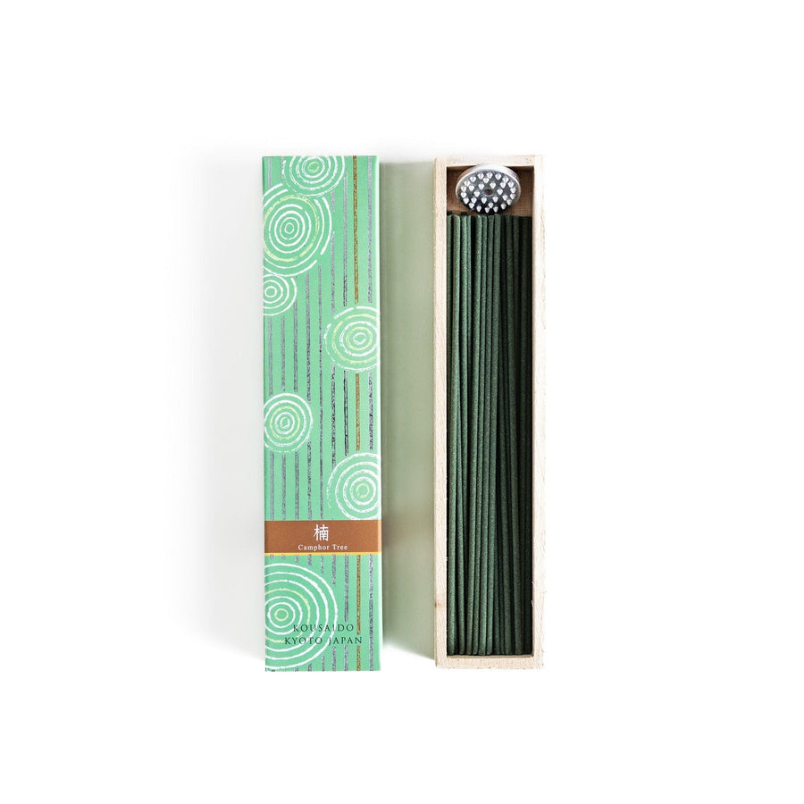 Japanese camphor tree incense sticks in a wooden box with a green patterned sleeve from Kyoto’s Kousaido