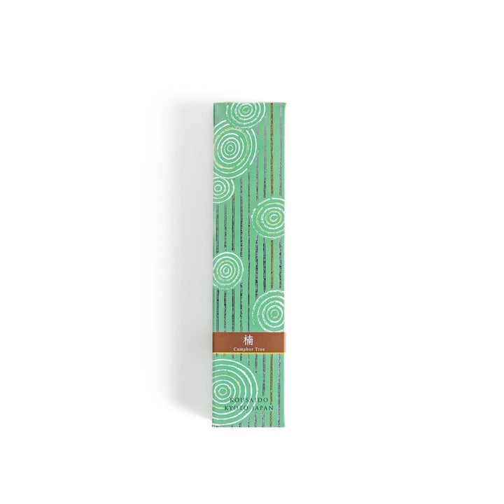 Japanese camphor tree incense sticks in a wooden box with a green patterned sleeve from Kyoto’s Kousaido