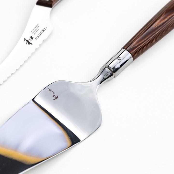 Set of Nagomi knives including a serrated knife and a pie server, both with wooden handles, displayed on a white background.