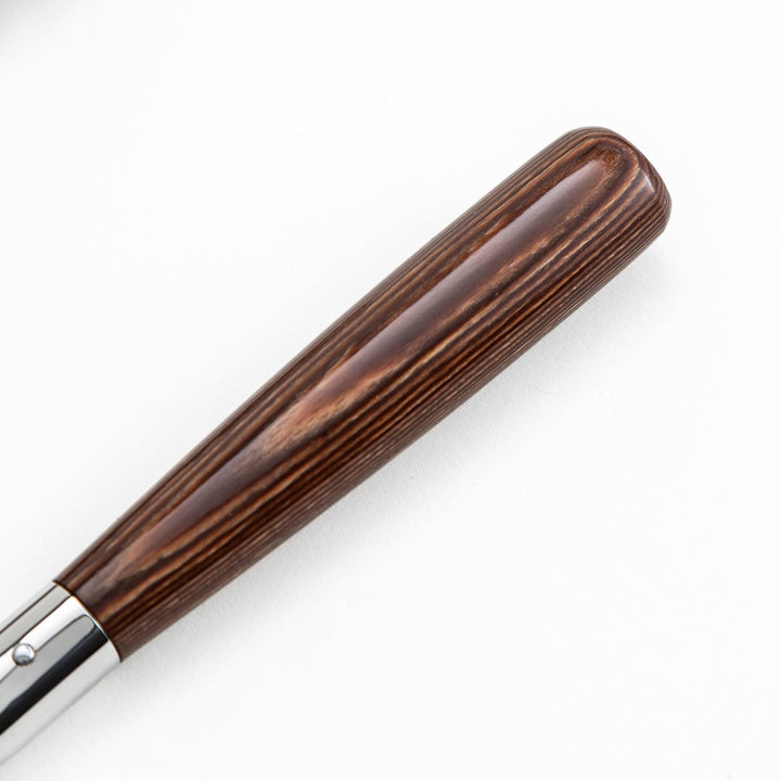 Set of Nagomi knives including a serrated knife and a pie server, both with wooden handles, displayed on a white background.