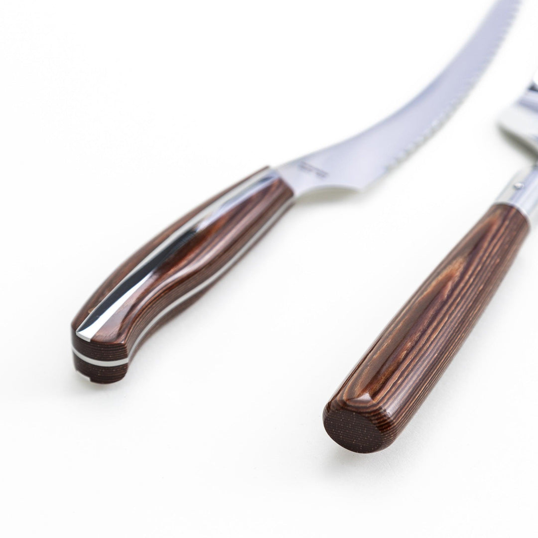 Set of Nagomi knives including a serrated knife and a pie server, both with wooden handles, displayed on a white background.