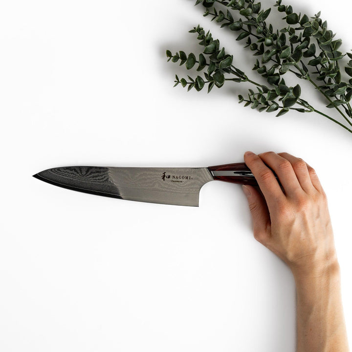 Handcrafted wooden tongs with a smooth surface and angled tips, perfect for stylishly serving or handling food.