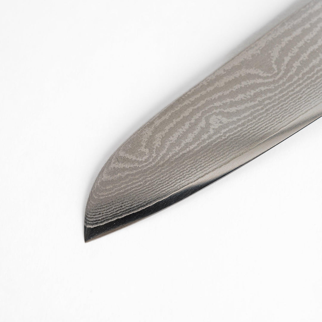 Japanese Damascus steel Santoku knife with patterned blade and polished red wood handle crafted by Nagomi Japan.