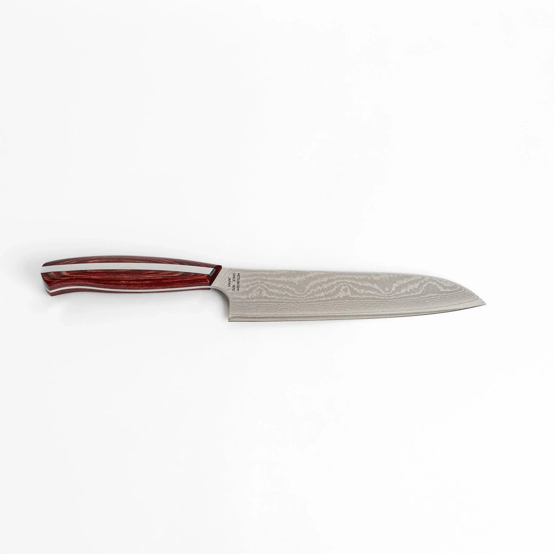 Japanese Damascus steel Santoku knife with patterned blade and polished red wood handle crafted by Nagomi Japan.
