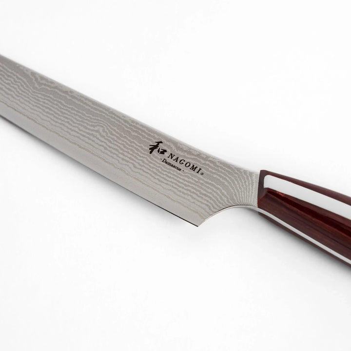 Nagomi Damascus utility knife with patterned blade and striped wooden handle offering precise everyday cutting.