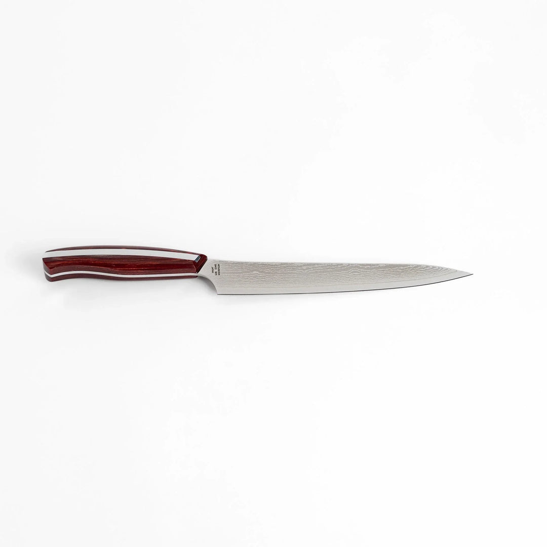 Nagomi Damascus utility knife with patterned blade and striped wooden handle offering precise everyday cutting.