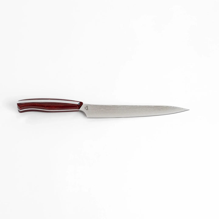 Nagomi Damascus utility knife with patterned blade and striped wooden handle offering precise everyday cutting.