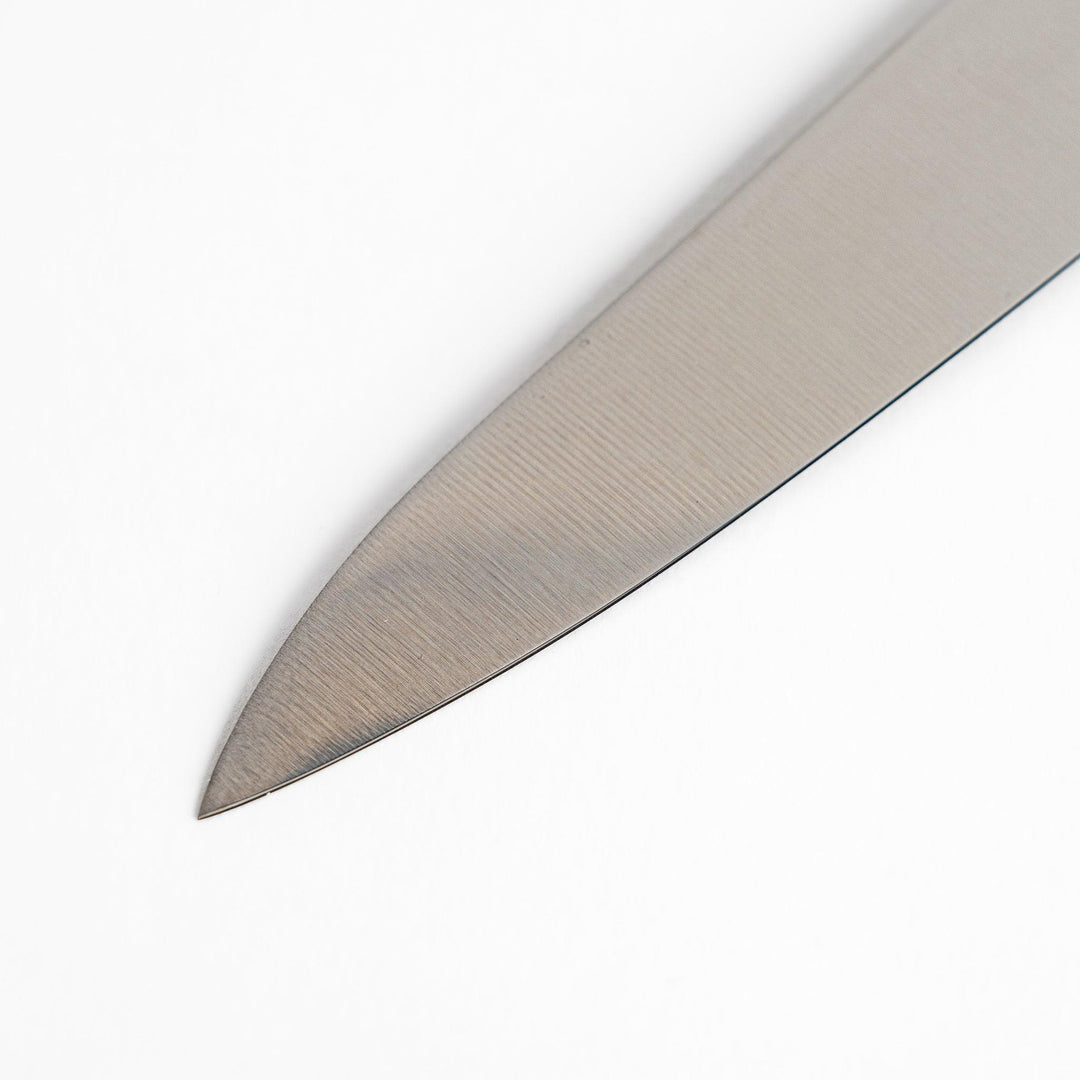 Nagomi utility knife with sharp durable blade and striped wooden handle designed for precise comfortable kitchen tasks.