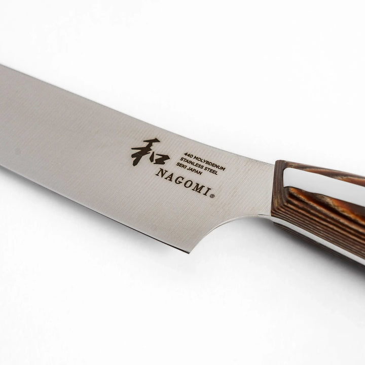 Nagomi utility knife with sharp durable blade and striped wooden handle designed for precise comfortable kitchen tasks.