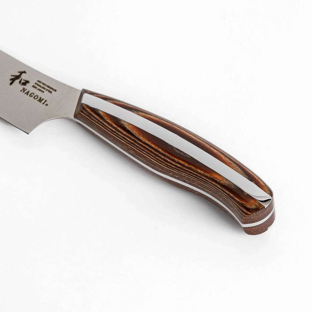 Nagomi utility knife with sharp durable blade and striped wooden handle designed for precise comfortable kitchen tasks.