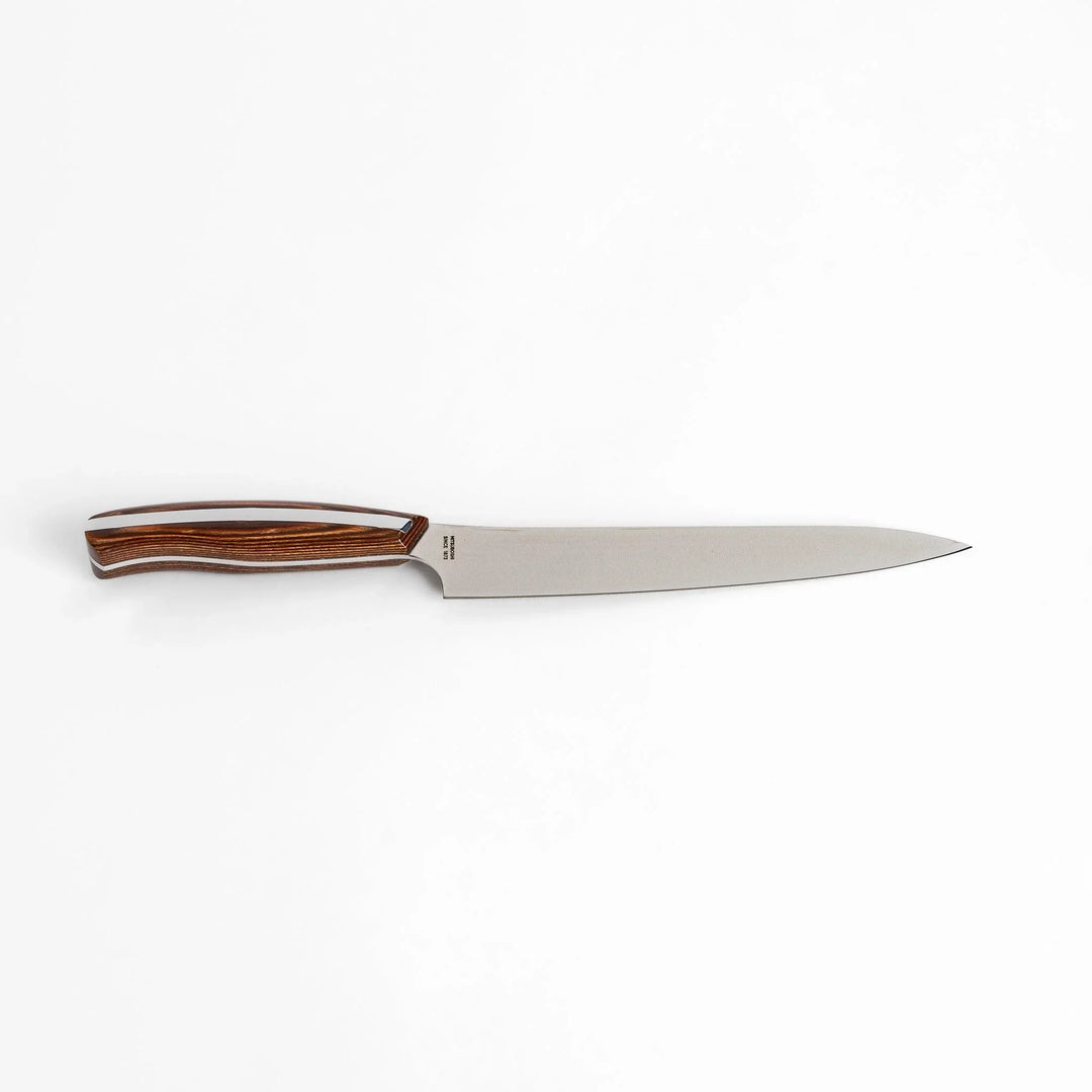 Nagomi utility knife with sharp durable blade and striped wooden handle designed for precise comfortable kitchen tasks.