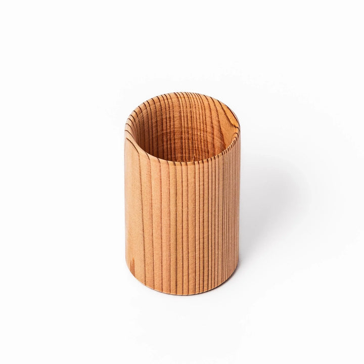 Cedar sake cup with smooth rim and visible grain, offering a warm, aromatic touch to traditional drinkware.