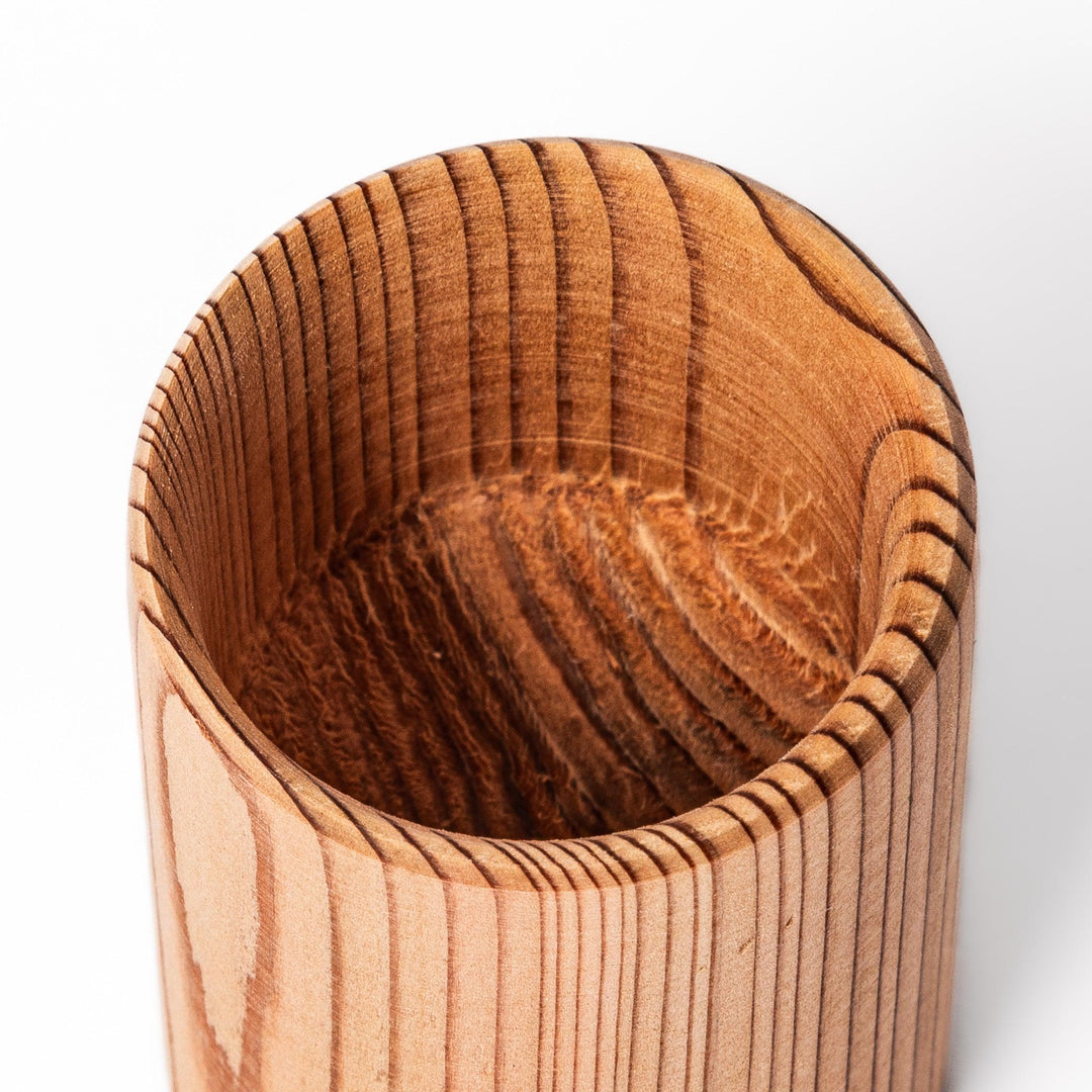 Cedar sake cup with smooth rim and visible grain, offering a warm, aromatic touch to traditional drinkware.