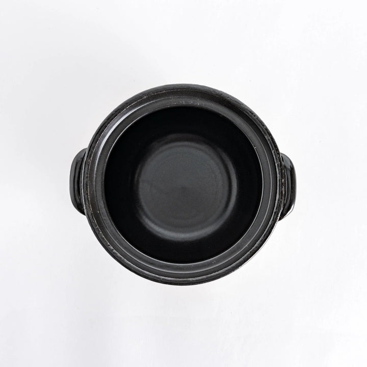 Donabe photographed from above without the lid, highlighting the spacious interior.