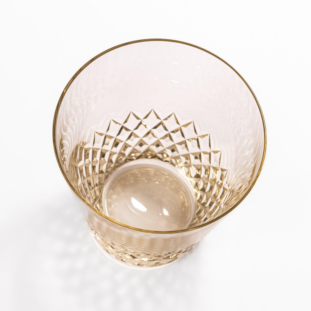 Amber nostalgia rocks glass with diamond-cut base and tapered shape, ideal for whisky, cocktails, or stylish everyday drinks.