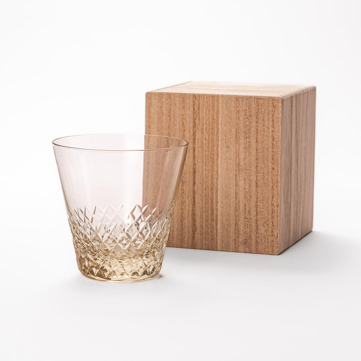 Amber nostalgia rocks glass with diamond-cut base and tapered shape, ideal for whisky, cocktails, or stylish everyday drinks.