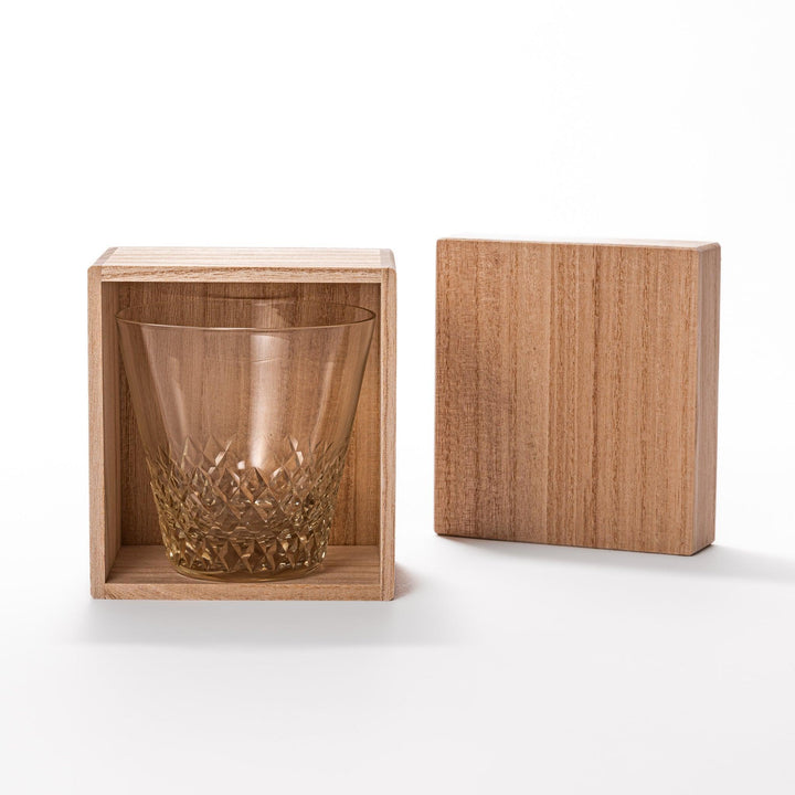 Amber nostalgia rocks glass with diamond-cut base and tapered shape, ideal for whisky, cocktails, or stylish everyday drinks.