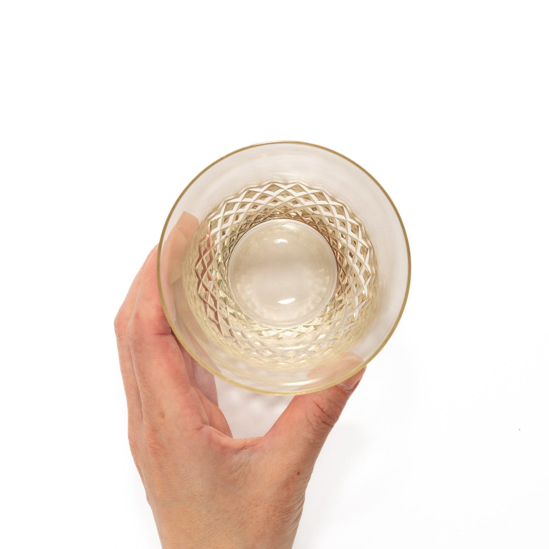 Amber nostalgia rocks glass with diamond-cut base and tapered shape, ideal for whisky, cocktails, or stylish everyday drinks.