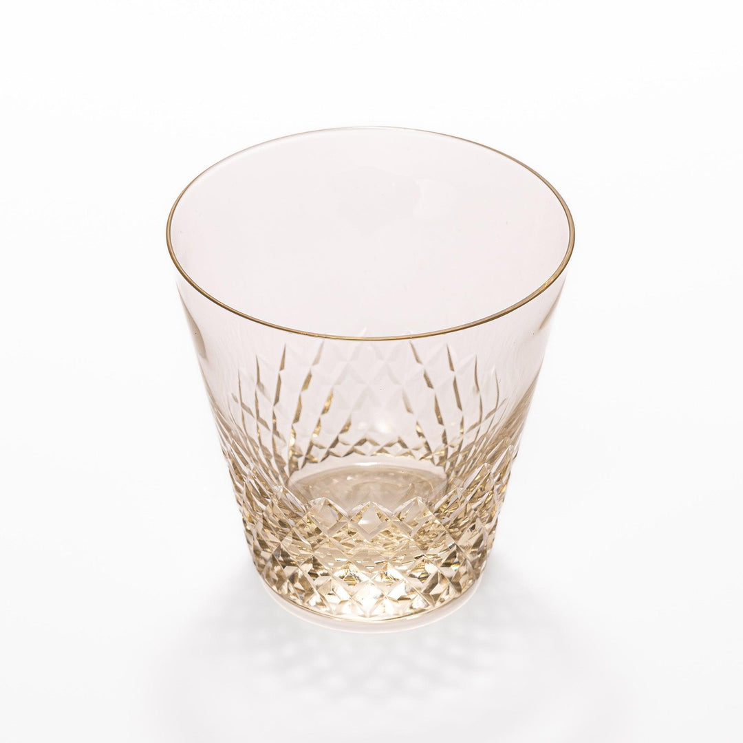 Amber nostalgia rocks glass with diamond-cut base and tapered shape, ideal for whisky, cocktails, or stylish everyday drinks.
