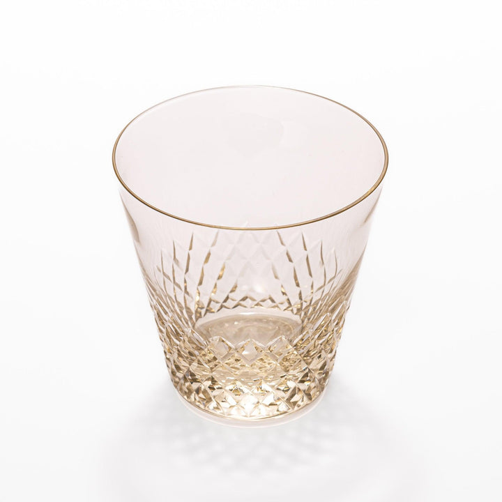 Amber nostalgia rocks glass with diamond-cut base and tapered shape, ideal for whisky, cocktails, or stylish everyday drinks.