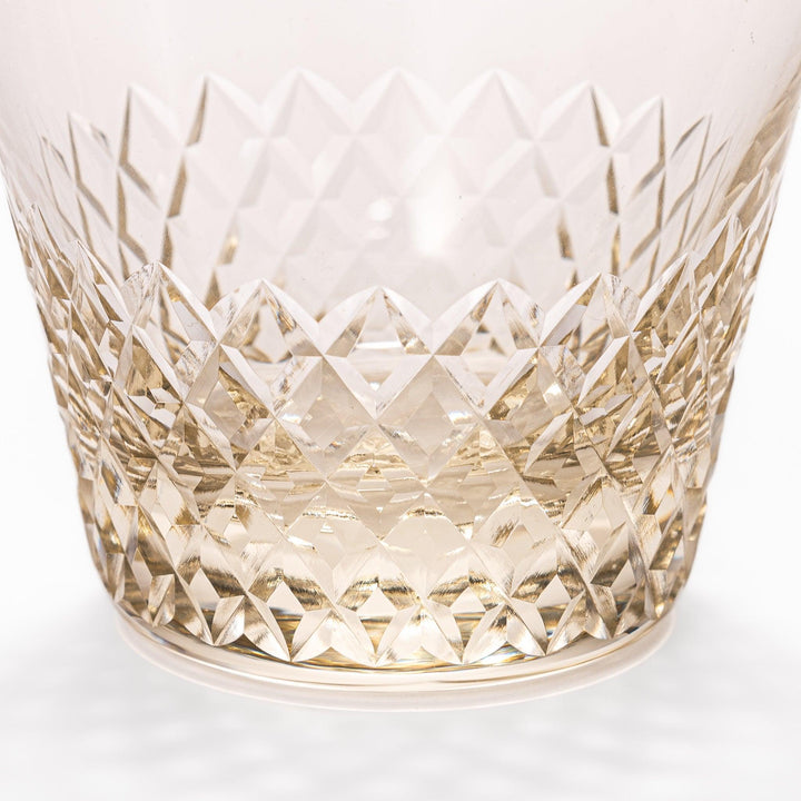 Amber nostalgia rocks glass with diamond-cut base and tapered shape, ideal for whisky, cocktails, or stylish everyday drinks.