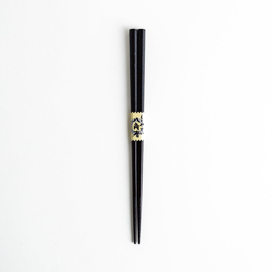 Octagonal wooden chopsticks with a brown tone, finished with a textured grain. Available in red or black.