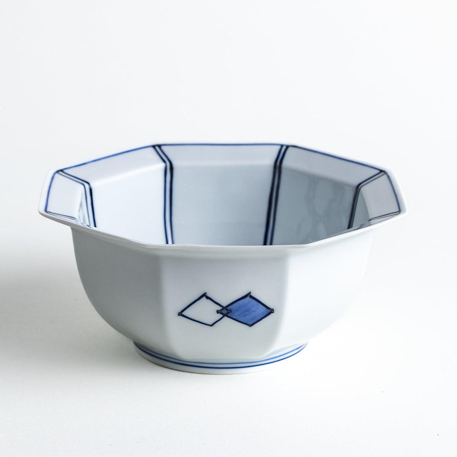 An octagonal porcelain cereal bowl with a minimalist grid pattern