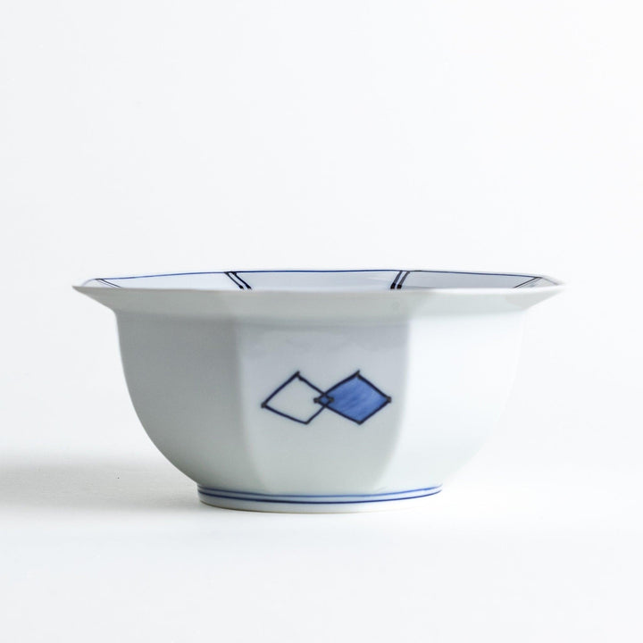 An octagonal porcelain cereal bowl with a minimalist grid pattern